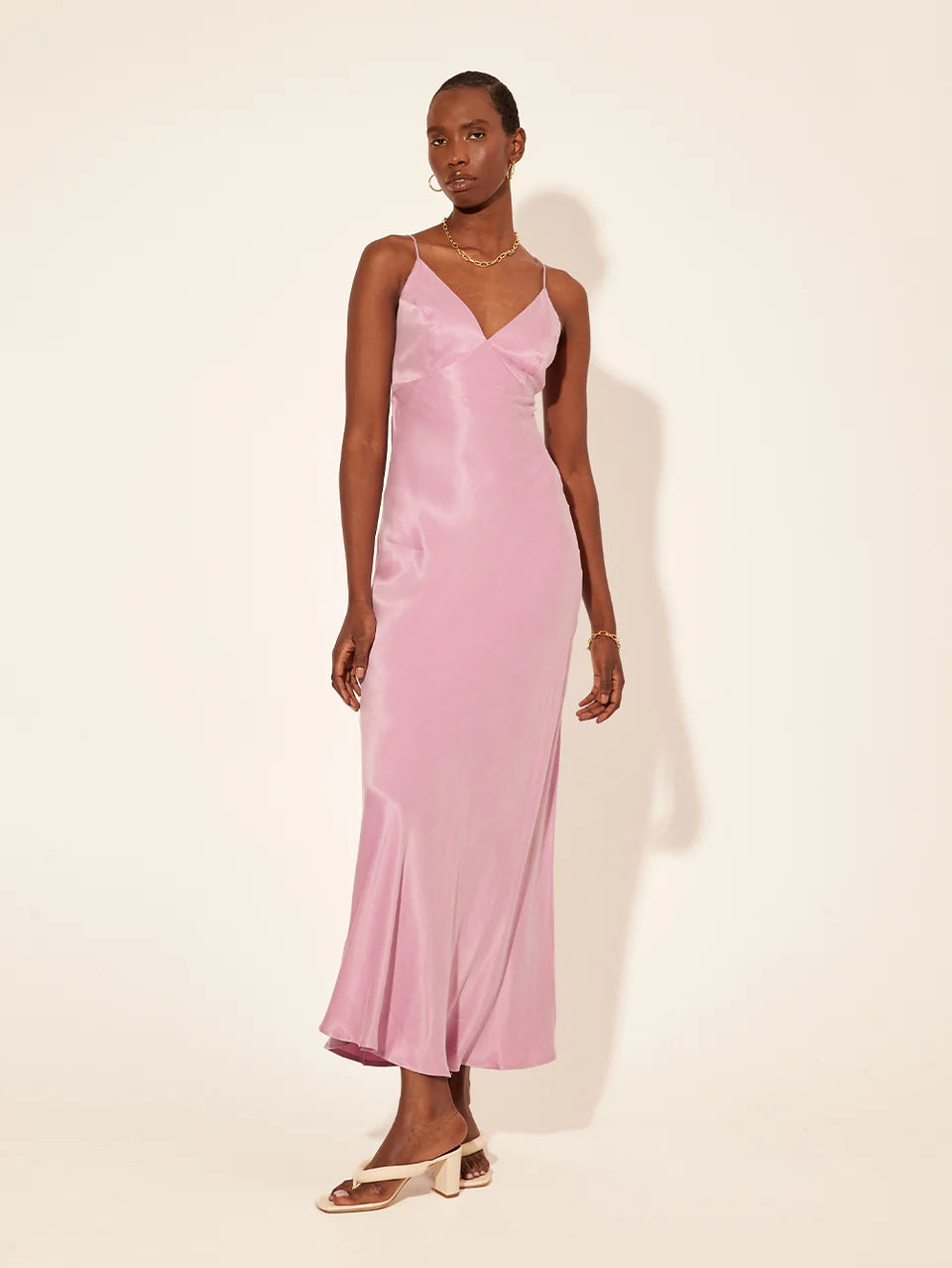 Kivari Bianca Slip Maxi Dress in lilac, made from a sand-washed cupro blend. Features a v-neckline and open back, ideal for your next vacation.