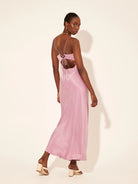 Kivari Bianca Slip Maxi Dress in lilac, made from a sand-washed cupro blend. Features a v-neckline and open back, ideal for your next vacation.