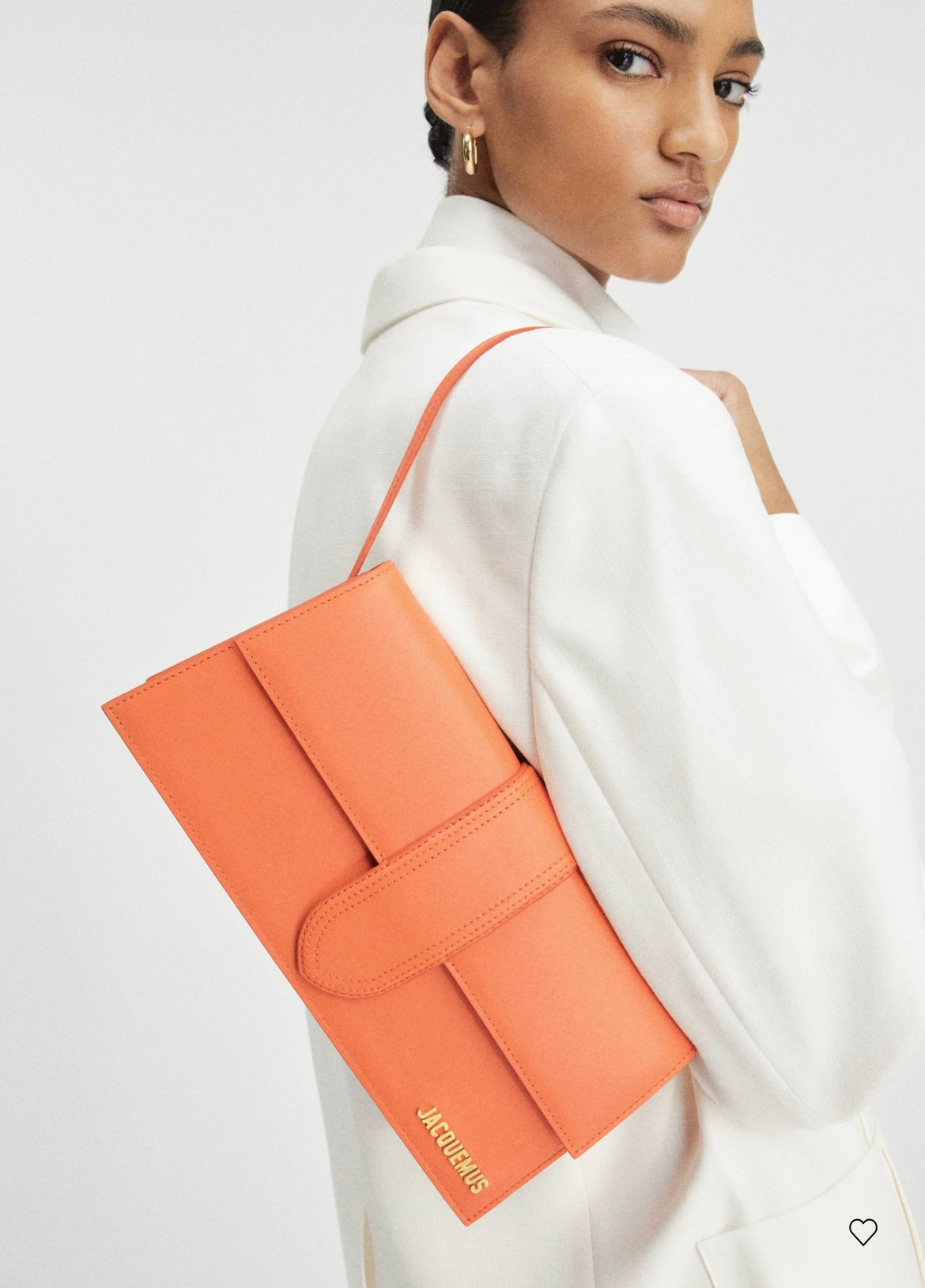 Jacquemus Orange Le Bambino Long Leather Shoulder Bag, crafted from luxurious orange leather. Features a sleek silhouette, spacious interior, and versatile design, perfect for adding a touch of luxury to any outfit.