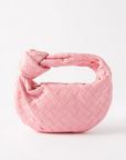 Rent for your upcoming holiday! Unique, Handcrafted bag, craftmanship, dress like Hailey Bieber. Available in the Netherlands and Belgium. Rent Bottega Veneta Mini Jodie pink