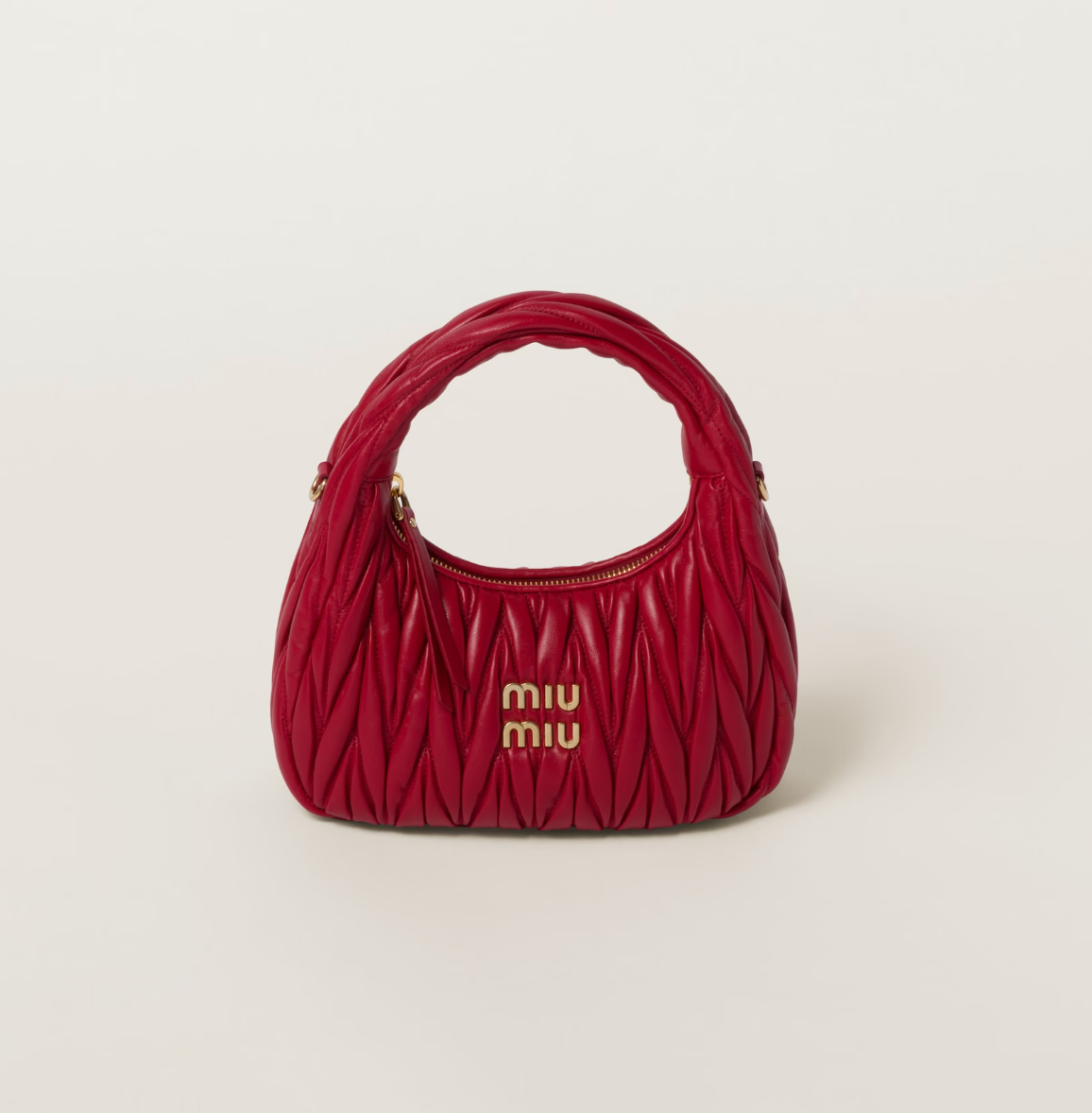 Rent for your upcoming holiday! Image of Miu Miu Wander Matelassé Nappa Leather Hobo Bag in [insert color] - Quilted design crafted from luxurious Nappa leather, featuring spacious hobo silhouette and iconic Miu Miu branding.