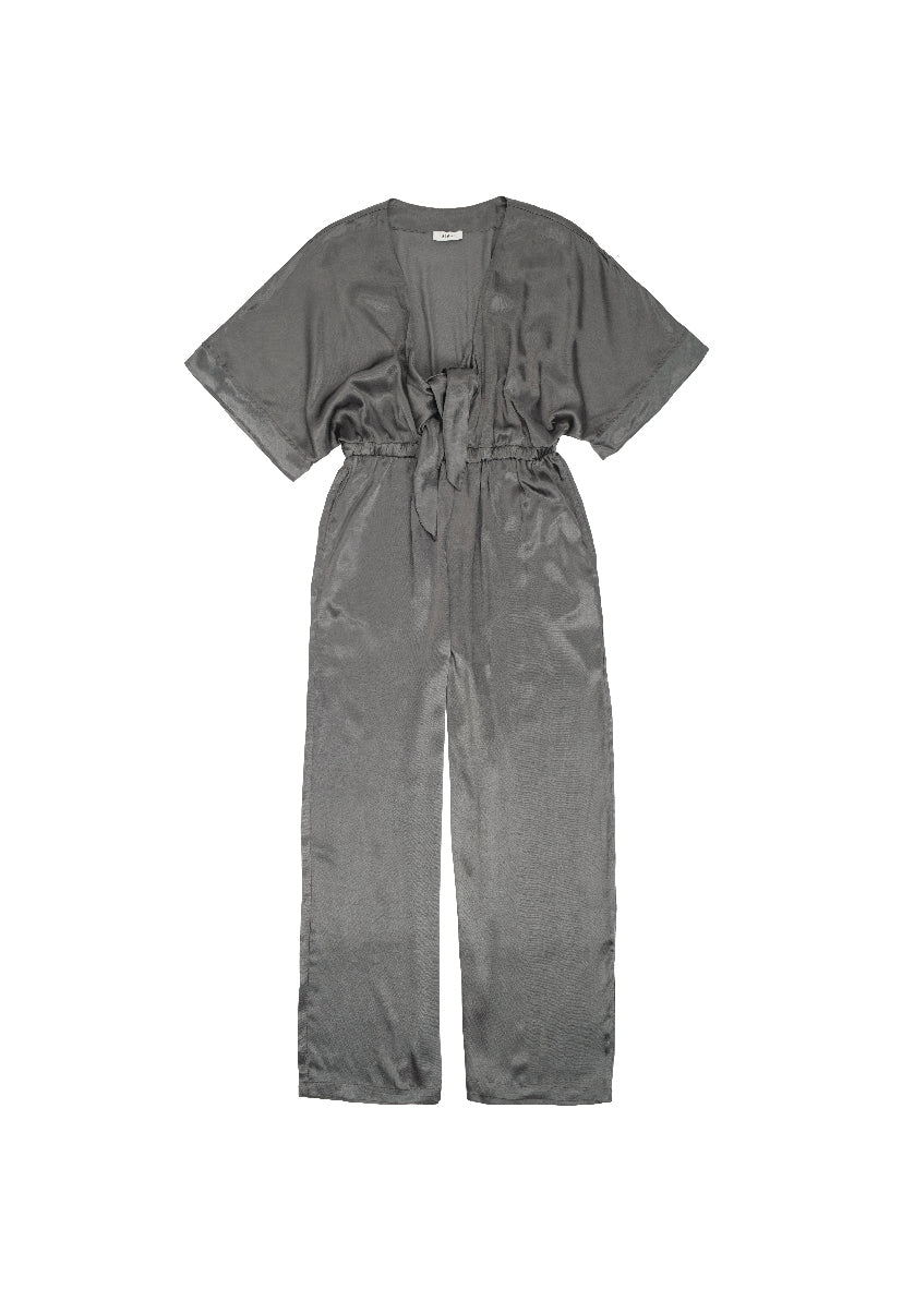 The Bysigne Anaise Jumpsuit in grey offers modern style and comfort in one chic piece. With its flattering silhouette and versatile color, it&#39;s perfect for any occasion, whether you&#39;re dressing up or keeping it casual.